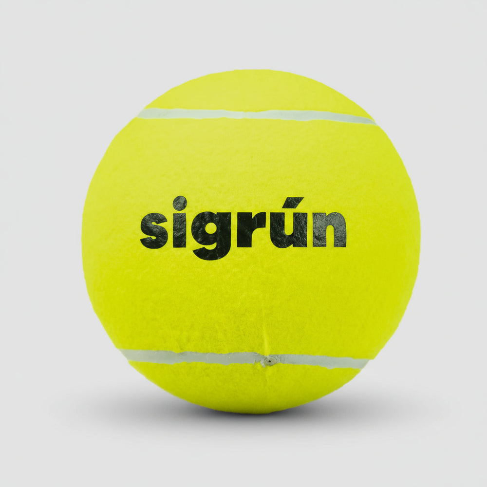 Yellow tennis ball with 'sigrön' branding on a light gray background